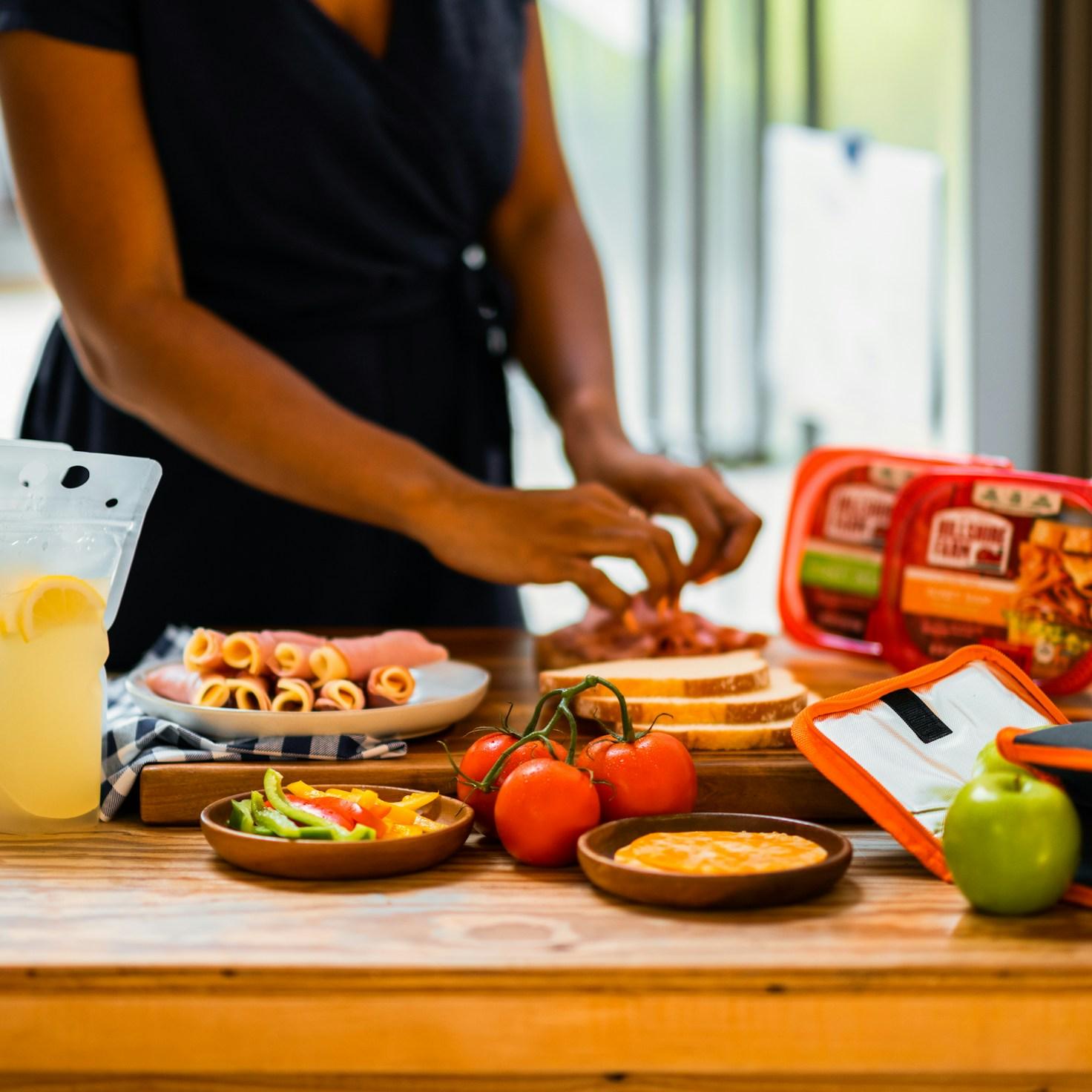 Diverse group of community members sharing a meal, highlighting the bonds formed through collaborative cooking